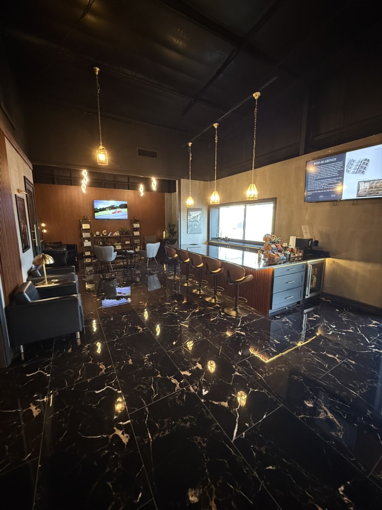 Renovated Fox Motors customer lounge with seating and coffee bar